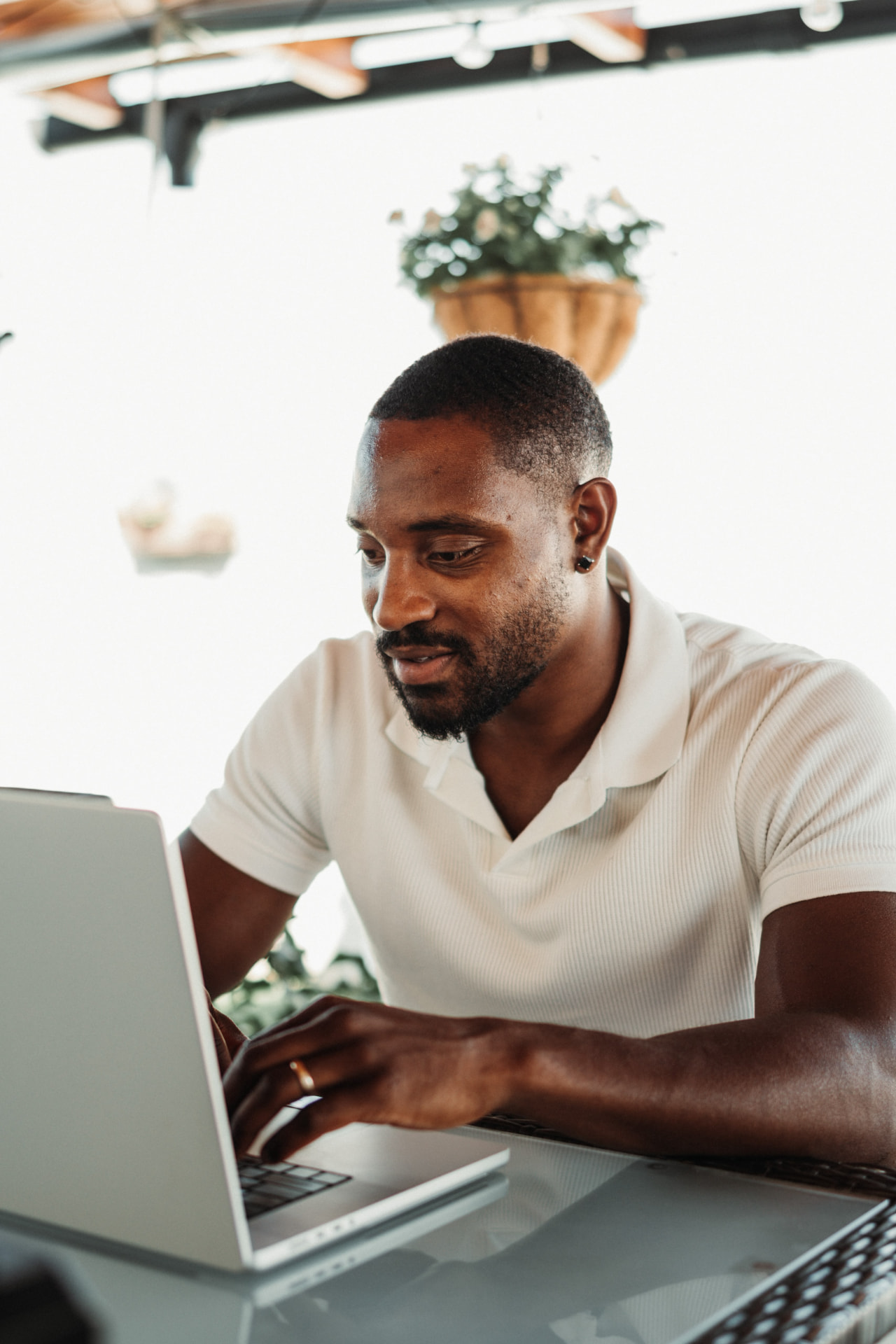 Martel Metellus working on his laptop
